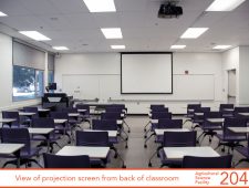 View of projection screen from back of classroom