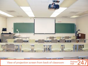 View of projection screen from back of classroom