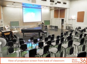 View of projection screen from back of classroom
