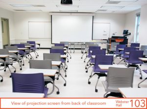 View of projection screen from back of classroom