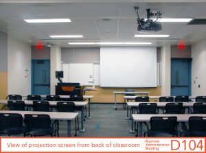 View of projection screen from back of classroom