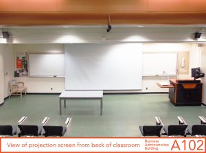 View of projection screen from back of classroom
