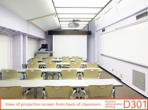 View of projection screen from back of classroom