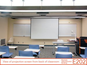 View of projection screen from back of classroom