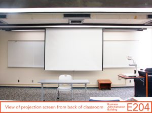 View of projection screen from back of classroom
