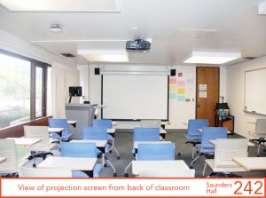 View of projection screen from back of classroom