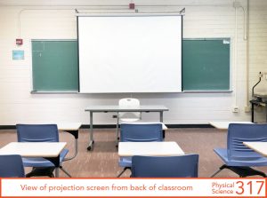 View of projection screen from back of classroom
