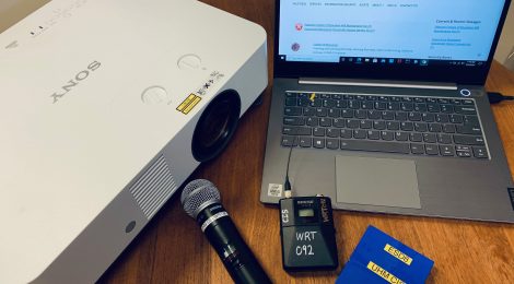 Photo of some equipment available to loan: projector, wireless microphones, laptop.