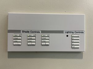 GAR 103 Window Shade & Lighting Controls (located on wall, left of lectern)
